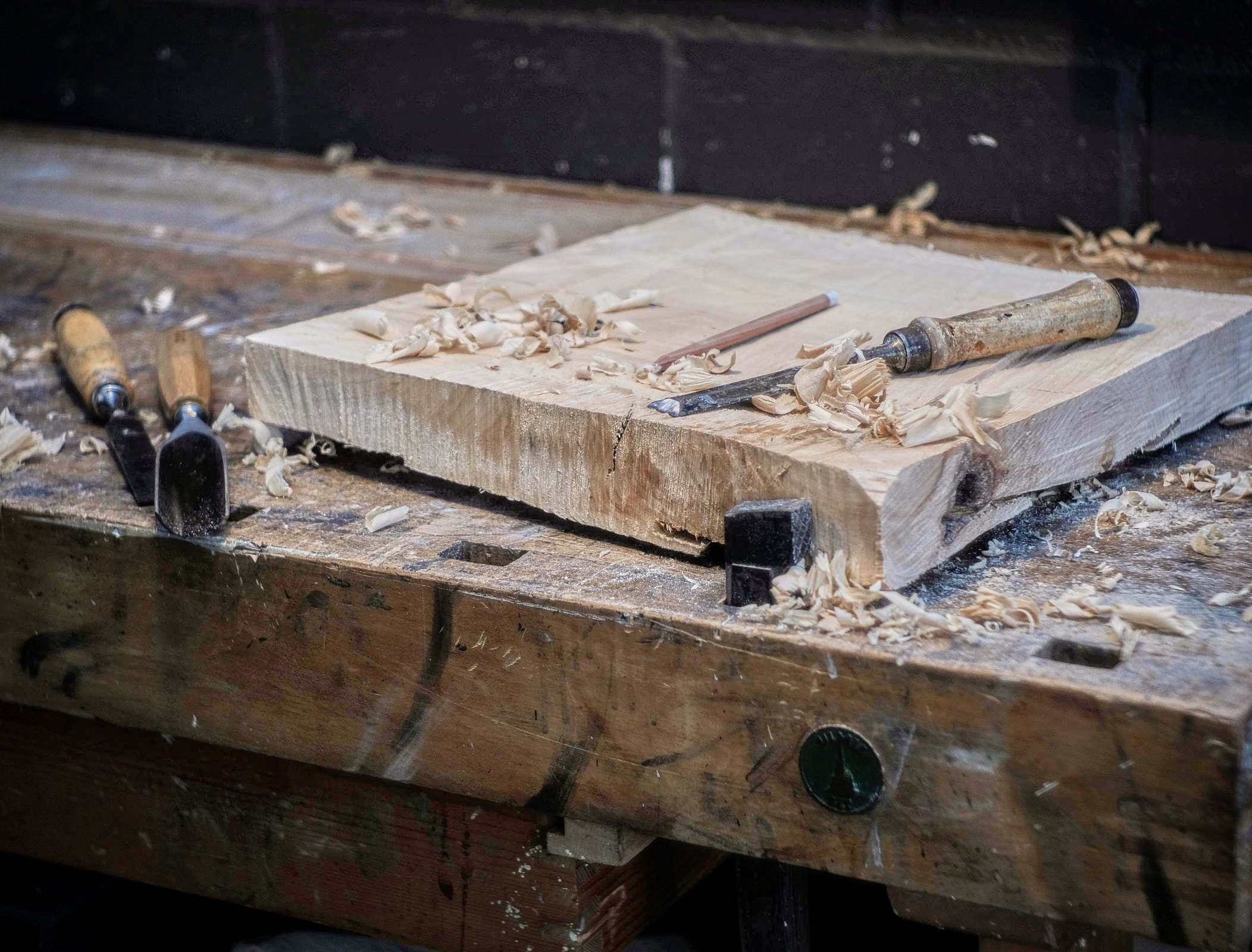 A piece of limewood being prepared for a sculpture by Fabian Ewert