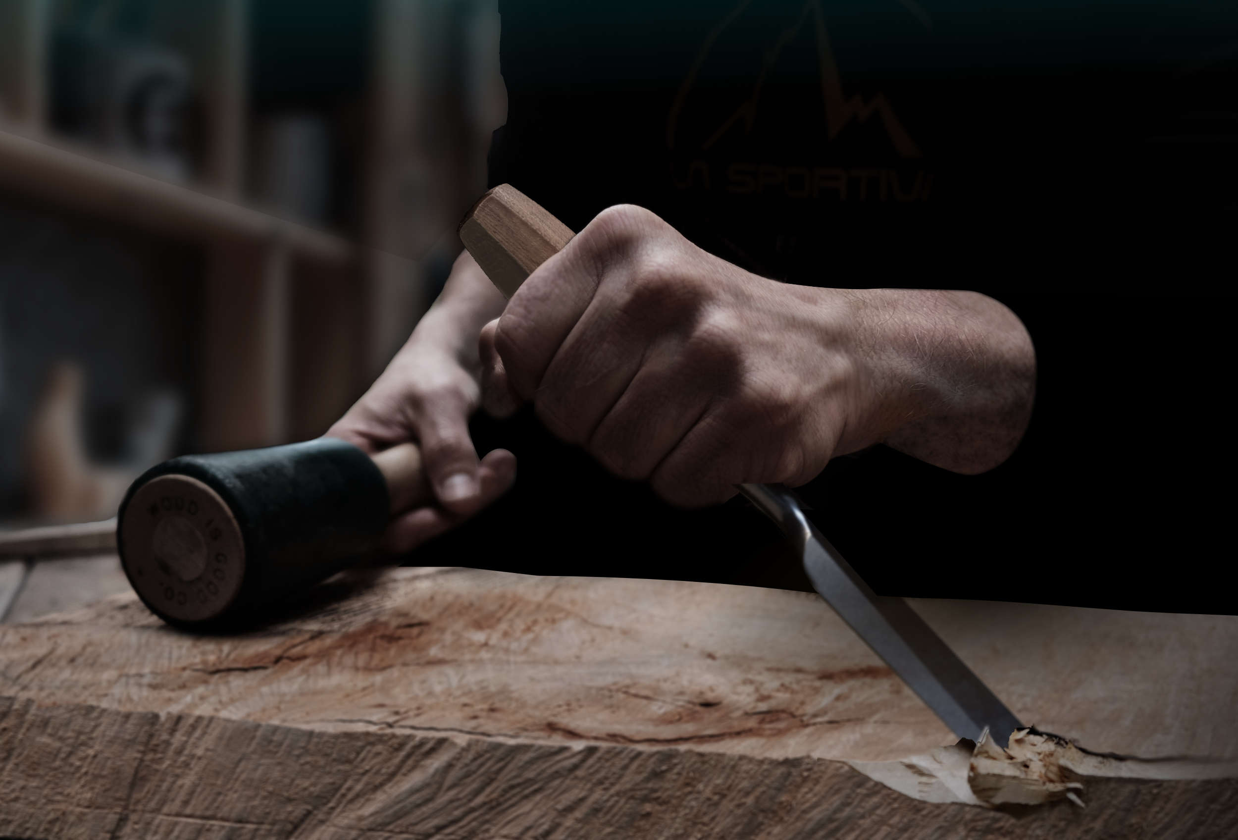 Sculptor Fabian Ewert sculpting contemporary wood art